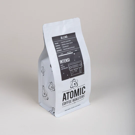A bag of Atomic Coffee Roaster Beans titled "Intensi"